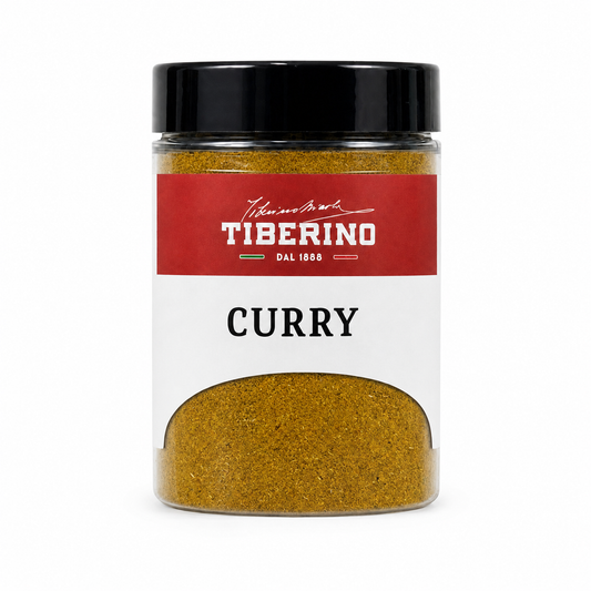 Barattolo trasparente Tiberino 1888 Curry non piccante da 40g, con polvere gialla, cucchiaio di legno, zenzero, aglio e peperoncino.