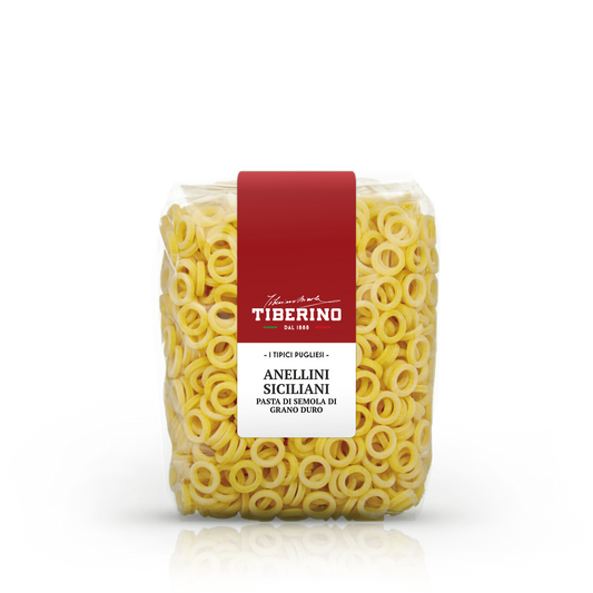 Confezione trasparente di pasta Anellini Siciliani Tiberino 1888, pasta di semola di grano duro, con etichetta rossa e bianca.