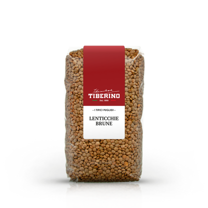 Sacchetto trasparente di lenticchie brune Tiberino 1888 con etichetta rossa e bianca, su sfondo bianco.