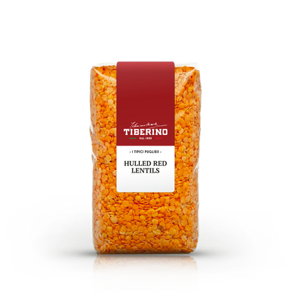 Sacchetto trasparente di lenticchie rosse decorticate Tiberino 1888 con etichetta rossa e bianca.