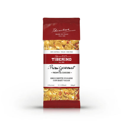 Confezione rossa opaca di Orecchiette Pugliesi con Ragù Vegan Tiberino 1888, 200g, con finestra trasparente che mostra la pasta.