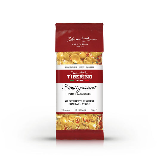 Confezione rossa opaca di Orecchiette Pugliesi con Ragù Vegan Tiberino 1888, 200g, con finestra trasparente che mostra la pasta.