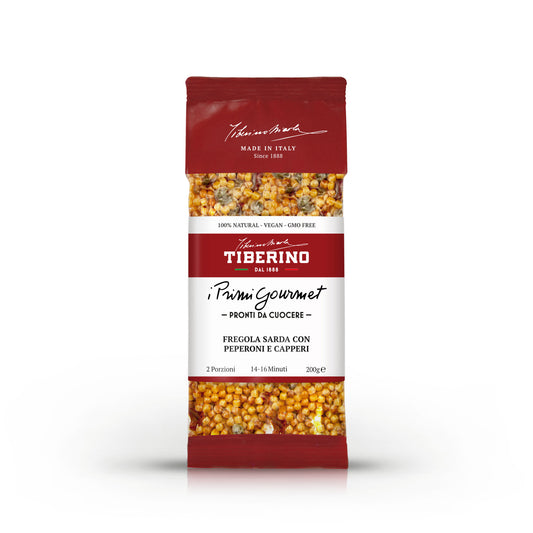 Confezione rossa di pasta Tiberino 1888 Fregola Sarda con Peperoni e Capperi, 200g, con finestra trasparente che mostra la pasta.