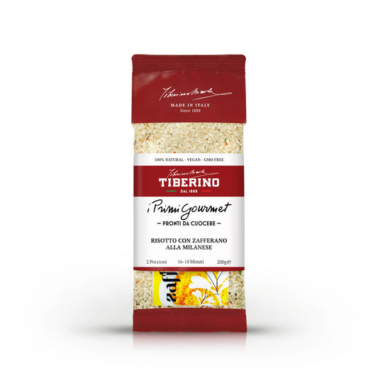Confezione rossa e trasparente di Risotto con Zafferano alla Milanese Tiberino 1888, 200g, con riso visibile.