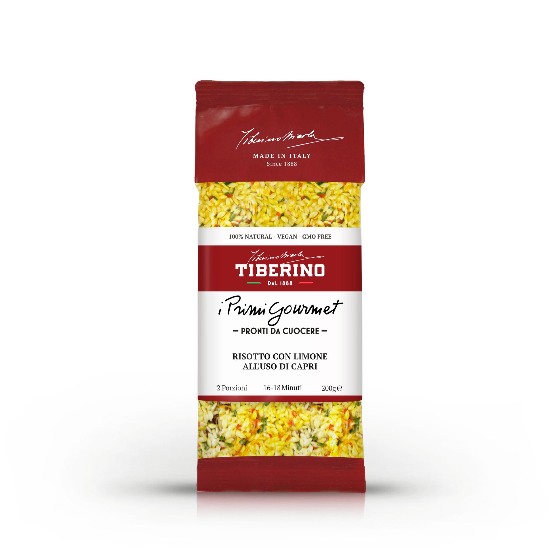 Confezione rossa di Risotto con Limone all'uso di Capri Tiberino 1888, 200g, con riso giallo e spezie visibili.