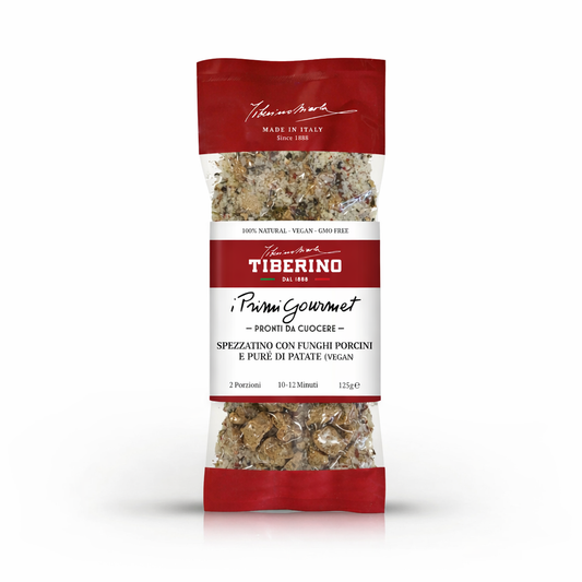 Confezione trasparente e rossa di Spezzatino con funghi porcini e purè di patate vegan Tiberino 1888, 125g.