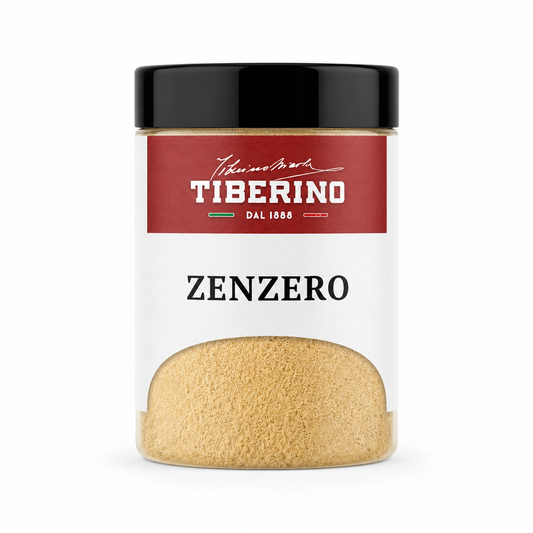 Barattolo trasparente con coperchio nero e etichetta rossa Tiberino 1888, contenente zenzero in polvere beige chiaro.