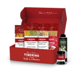 Cofanetto regalo rosso Tiberino 1888 con cinque pacchi di pasta, una bottiglia di olio d'oliva e un vasetto di salsa.