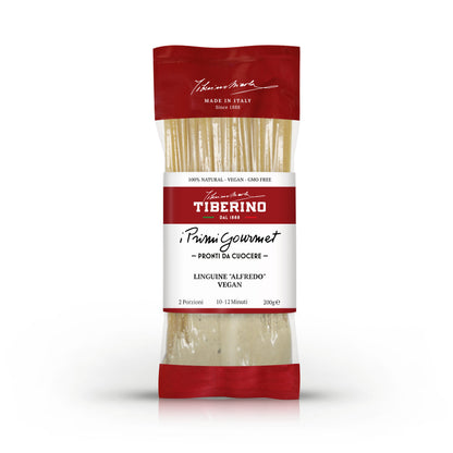 Confezione rossa e trasparente di Linguine "Alfredo" Vegan Tiberino 1888, 200g, con pasta visibile.