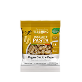 Confezione gialla e bianca di pasta istantanea Tiberino 1888 Vegan Cacio e Pepe, 65g, con pasta cotta e pepe nero.