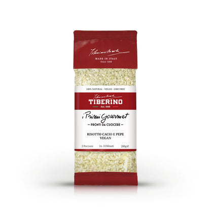 Confezione rossa e bianca di Risotto Cacio e Pepe Vegan Tiberino 1888, 200g, con riso visibile.