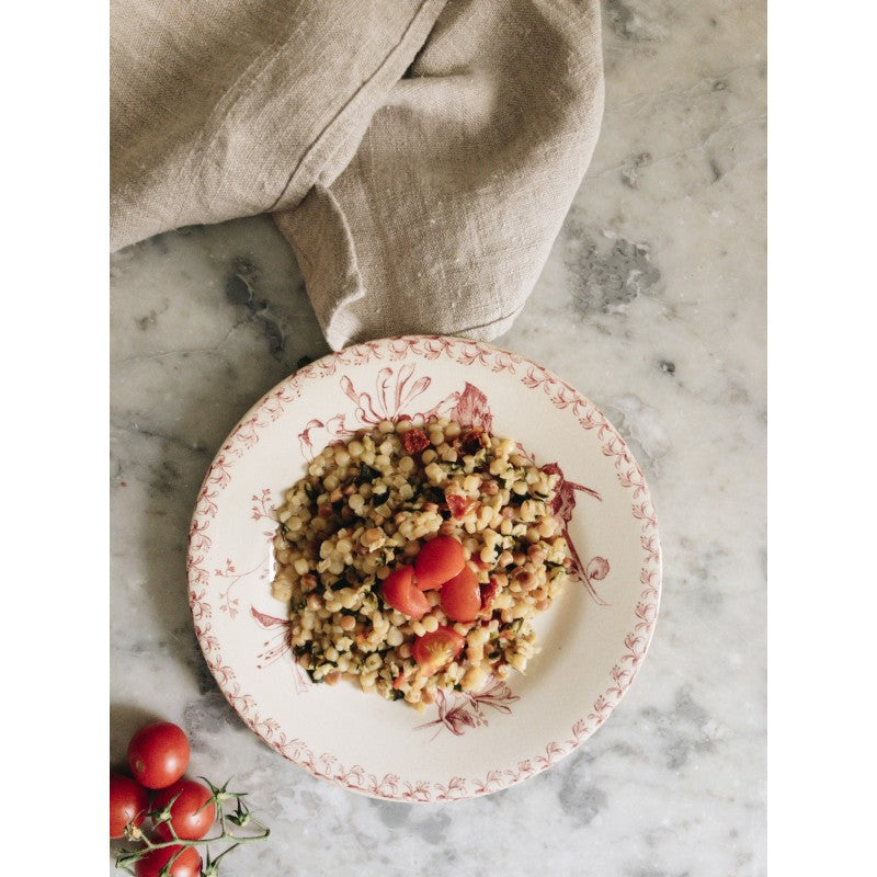 "Fregola" (or Fregula) pasta with red bell peppers and salted capers - Type of Italian pasta from the Sardinia region